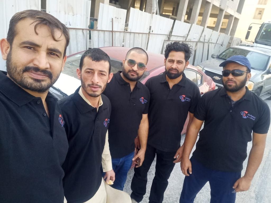 Al Rasco Elevator team of five certified technicians in branded black polo shirts